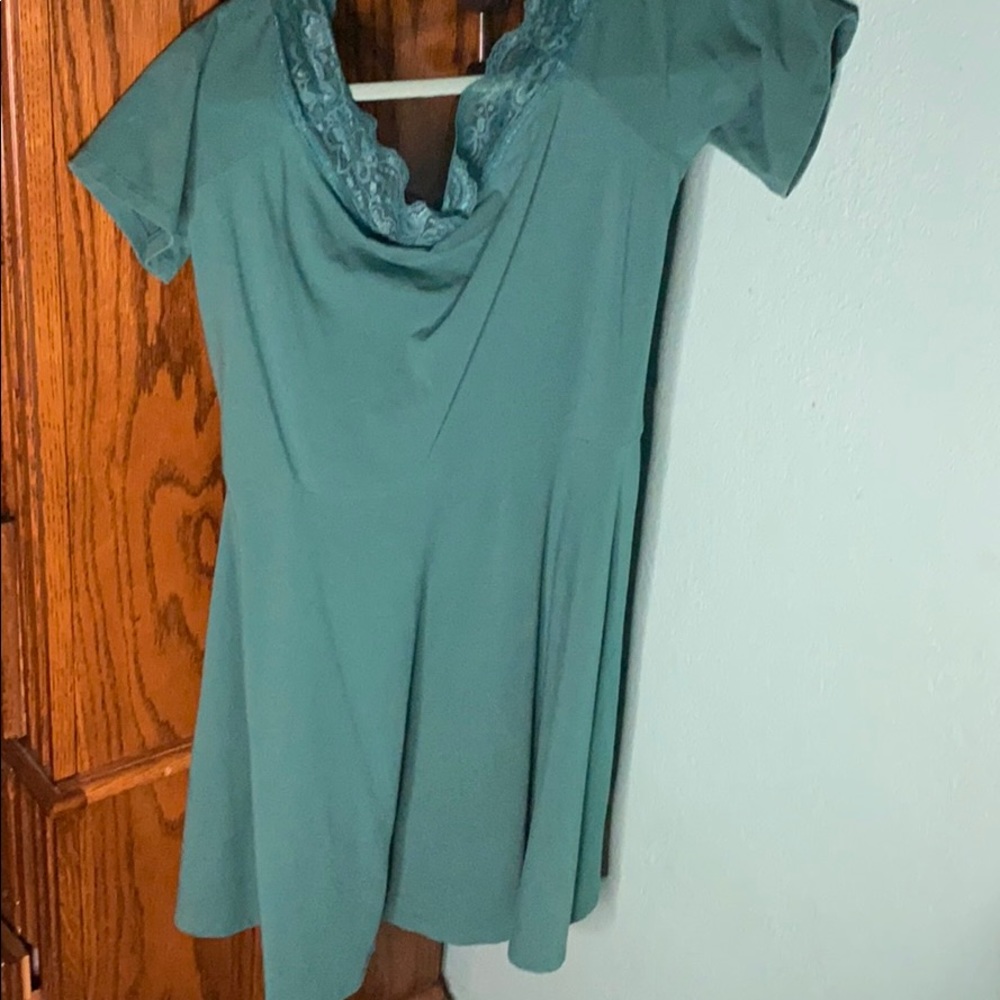 A drop shoulder, vibrant turquoise midi dress